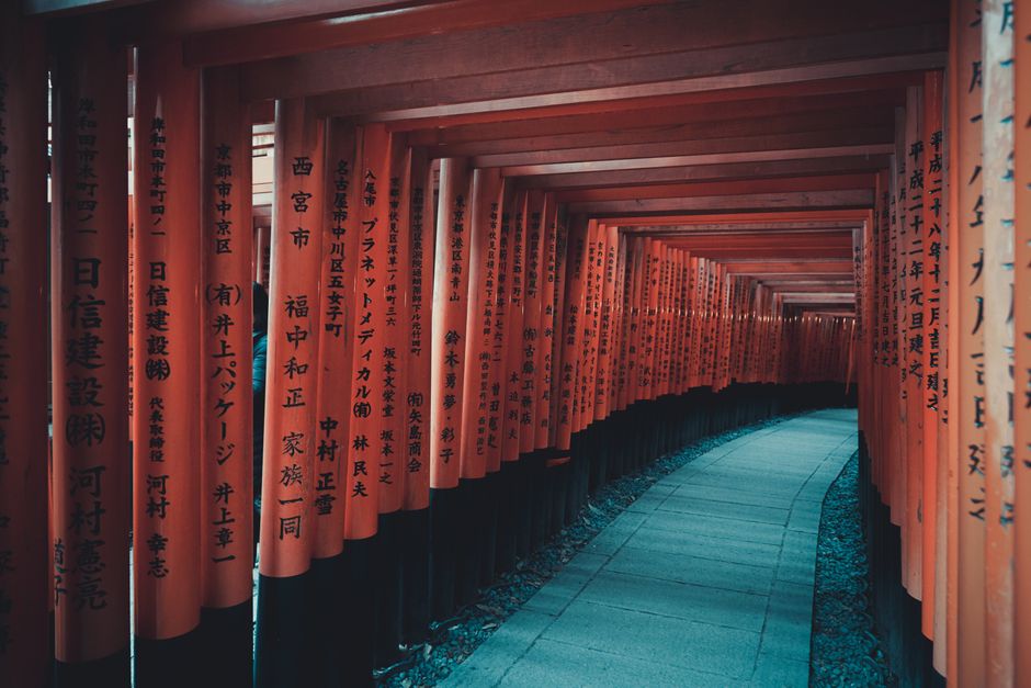 A mesmerizing view through the iconic torii gates of Fushimi Inari Taisha in Kyoto, Japan.