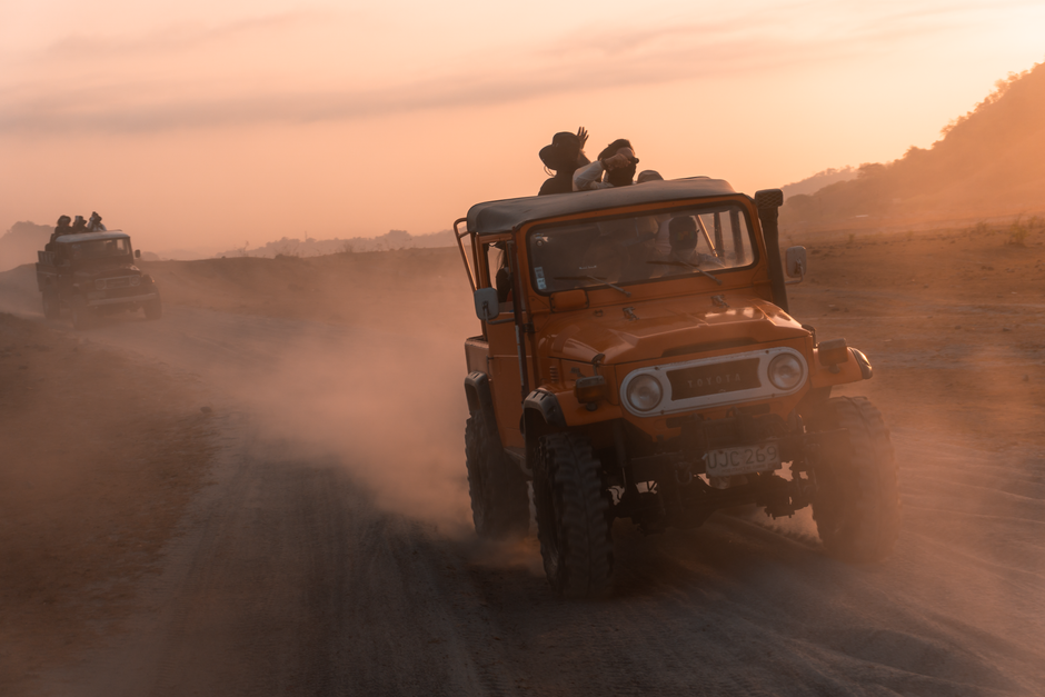 An off-road vehicle kicks up dust during a sunset expedition in Botolan, Philippines.